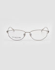 Anita eyeglasses by For Art's Sake® feature silver oval metal frames, thin design, clear nose pads, and lightweight comfort. The left lens displays the For Art's Sake® name on a white background.