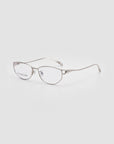 The Anita glasses by For Art's Sake® feature a silver geometric metal frame with clear lenses, shown on a plain white background and angled slightly left to highlight their lightweight, comfortable design.