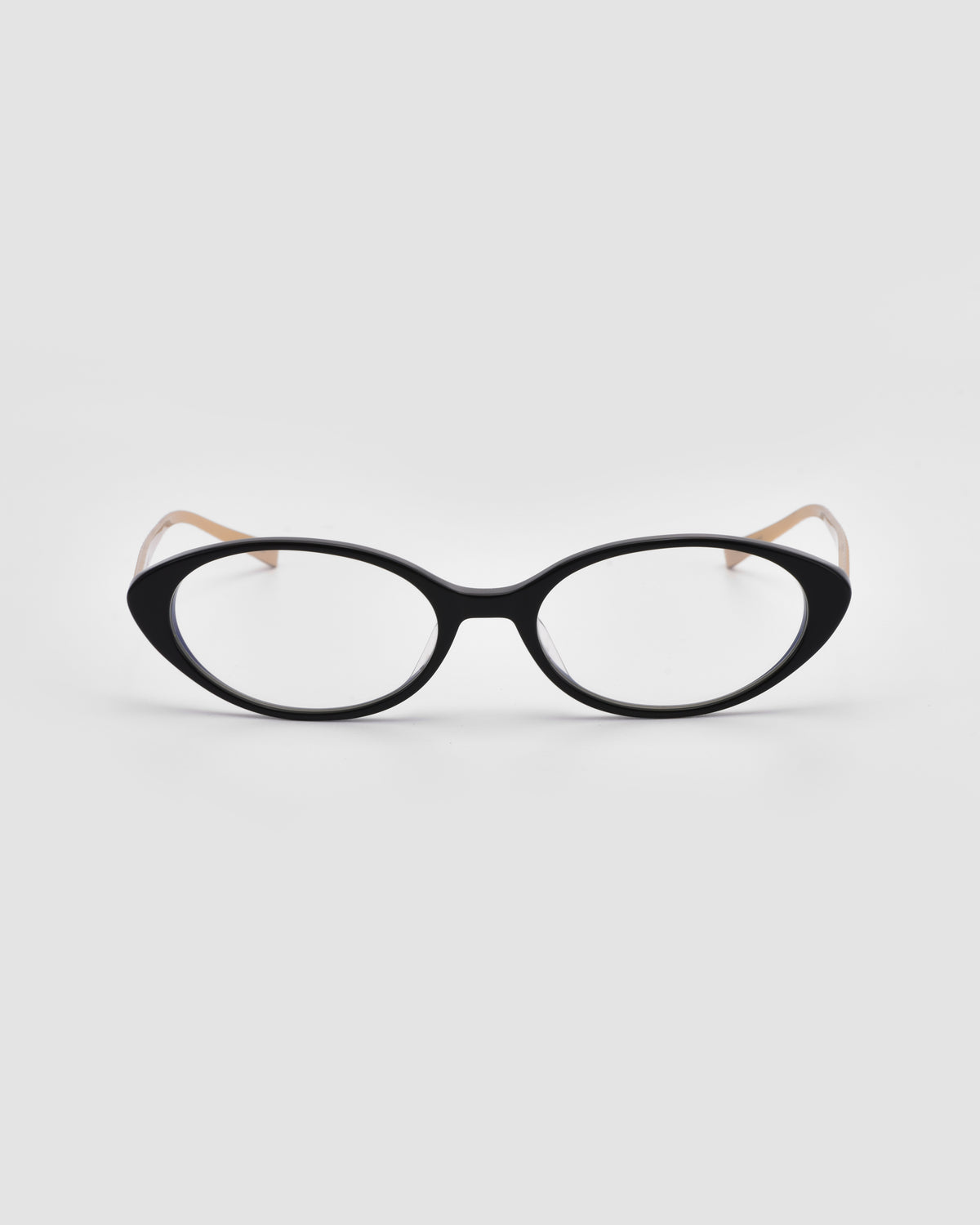 Lumi II by For Art’s Sake® features black cat-eye acetate frames with clear lenses and light beige arms, shown on a plain white background.