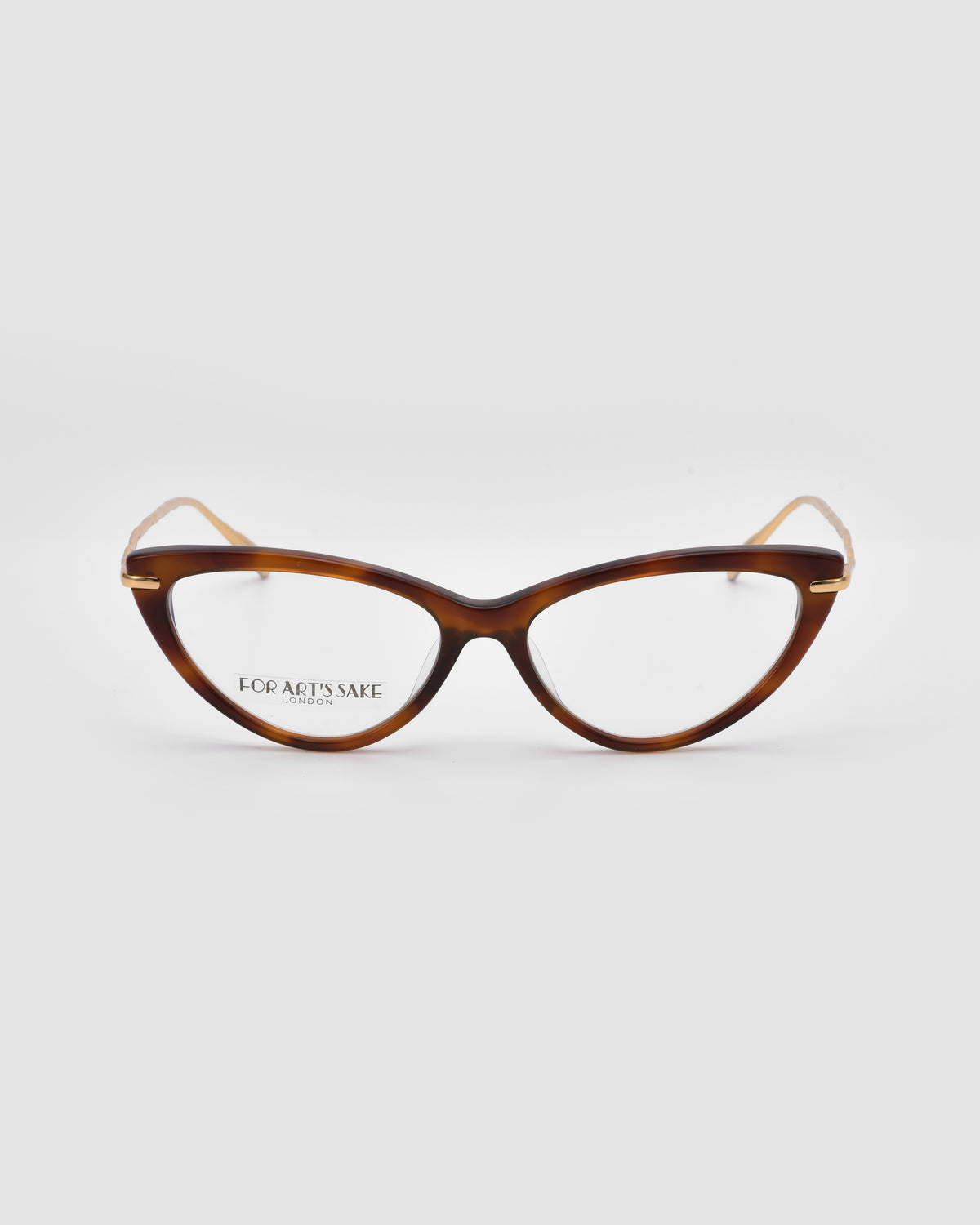 Solange by For Art’s Sake®: Cat-eye opticals with a brown tortoiseshell frame, sculpted gold metal temples, and clear lenses—jewellery-inspired glasses on a white background.