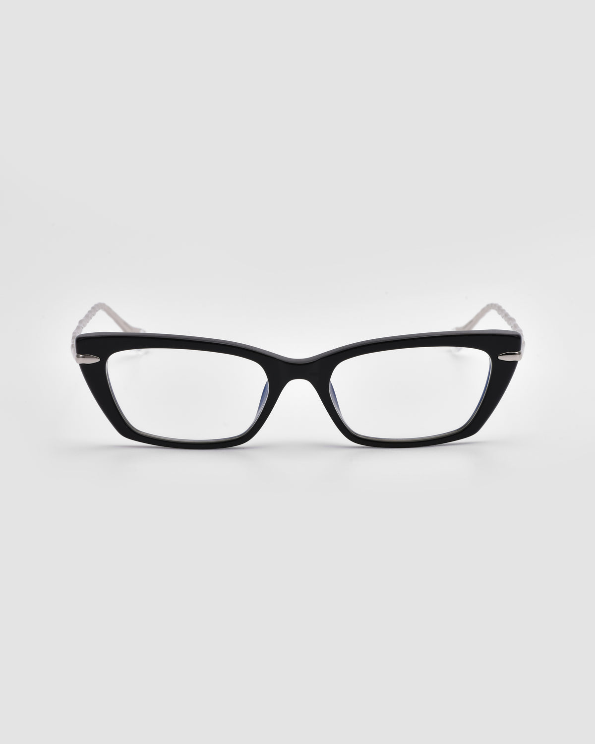 The Amara II by For Art’s Sake® is a black rectangular optical frame with thick fronts and sculpted nylon temple tips, shown from the front on a plain light gray background.