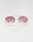 The Yoyo - ARC sunglasses by For Art's Sake® feature handmade 18-karat gold plating, gradient pink lenses on a white backdrop, and an elegant design with a double bridge, thin black temples, and clear nose pads.
