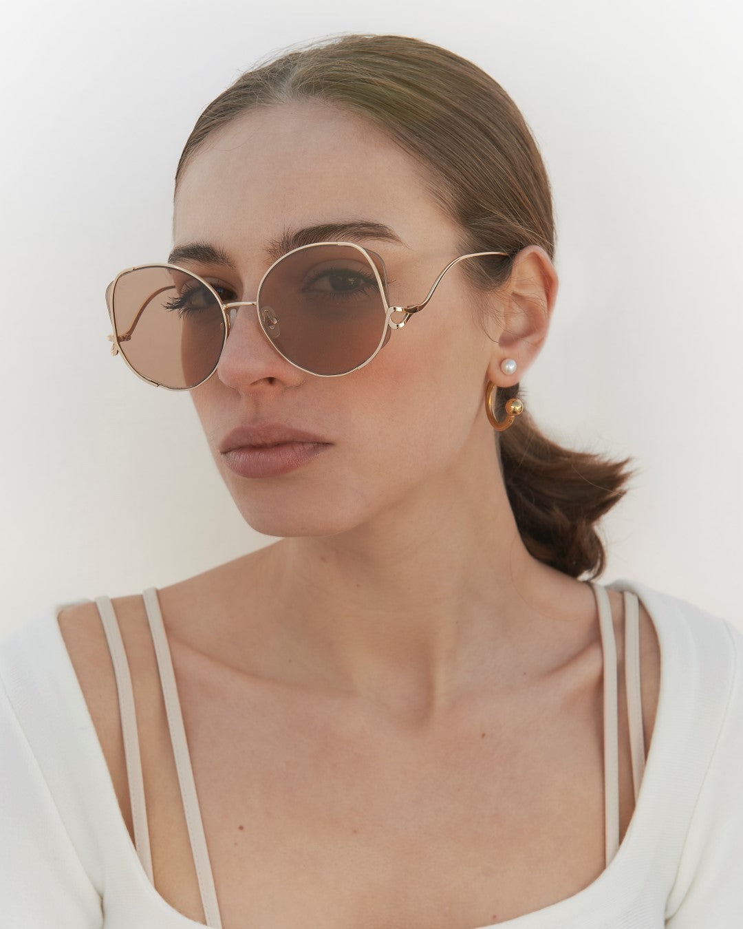 Canvas Sunglasses in Sand on a Model.