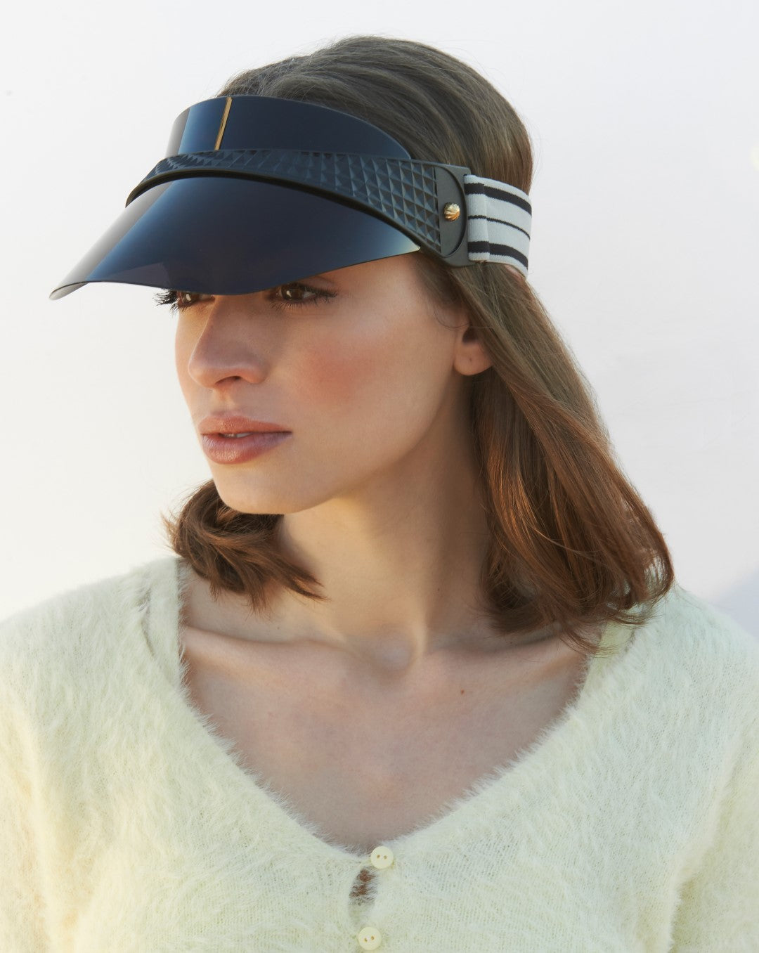An image of a model wearing our Cloud Visor in Black.